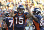 Denver Broncos quarterback Tebow celebrates with teammate Green after scoring a touchdown during the second quarter of the NFL AFC wildcard playoff football game against the Pittsburgh Steelers in Denver