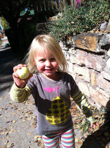 Q holds up the prize apple