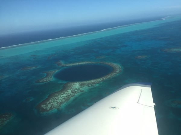 The Great Blue Hole is a 400-foot deep cave in the Mesoamerican Barrier Reef very popular with divers. Scientists from Rice University and Louisiana State University recently found evidence in the cave that supports the theory that drought and climate conditions pushed the Mayans from a regional power to a smattering of rival survivors and finally a virtually lost civilization. image: Armando Ubeda/LightHawk