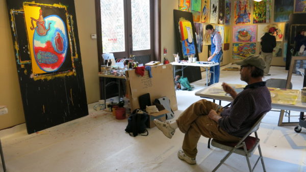 guy-looking-at-painting