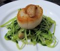 Wilted pea shoots and scallops