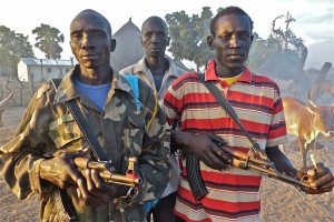 South Sudan police guarding Dau's clinic as Tabin and Crandall operate.