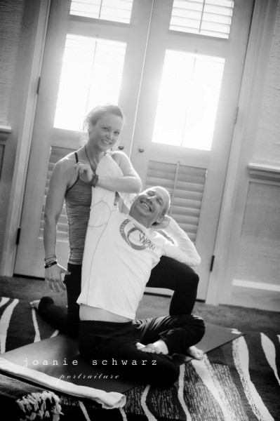 Ansley adjusting Albert Roer in her Thai Yoga class. Albert is co-owner/director of both WOW and Yoga Fest.