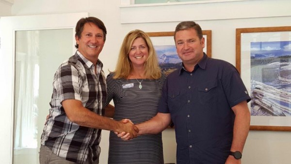   Mountain Village Mayor Dan Jansen, Robin Watkinson of Land Title and THD Chair Larry Mallard close the deal bringing a new facility one step closer to fruition. 