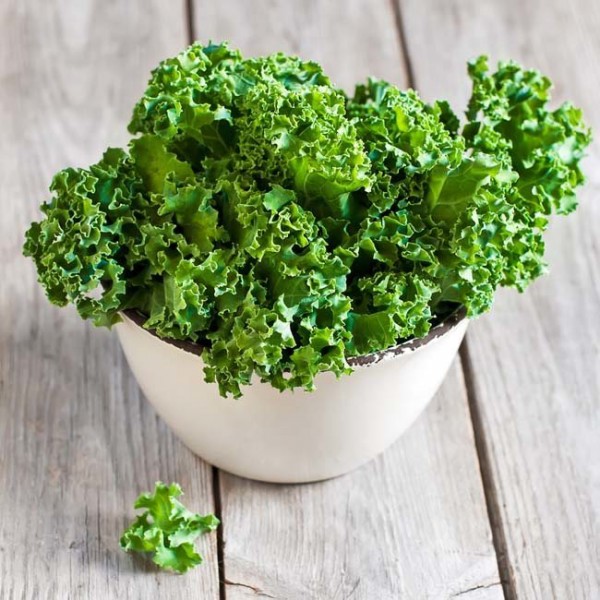 Kale is high in vitamins C & K, calcium and beta carotene. Chop it up, massage leaves with olive oil and toss with lemon and pepper. Credit Shuttercock.