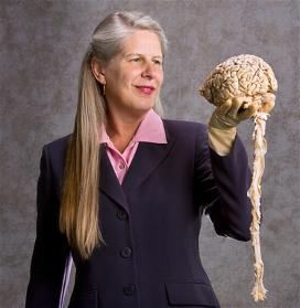 Dr. Jill Bolte Taylor, holding human brain, just as she did at her now-foamous TED Talk.