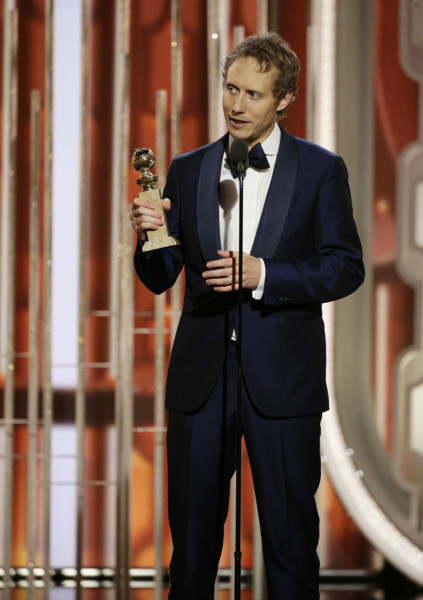 In this image released by NBC, Laszlo Nemes accepts the award for best foreign language film for "Son of Saul."