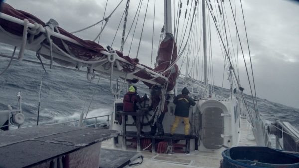  The crew of Infinity battling rough seas in Sea Gypsies: The Far Side of the World. [Courtesy of Mountainfilm]